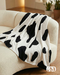 COW PRINT TUFTED SOFA THROW